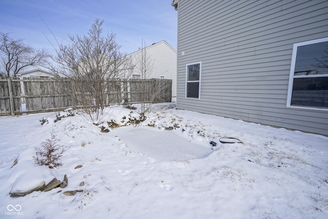 view of yard covered in snow