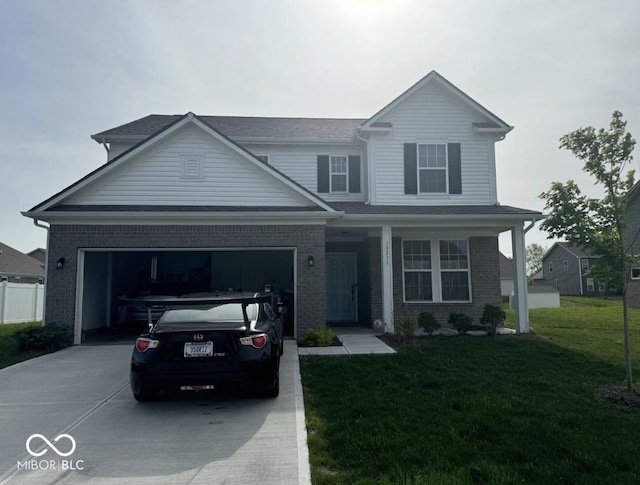 view of front property featuring a front lawn and a garage