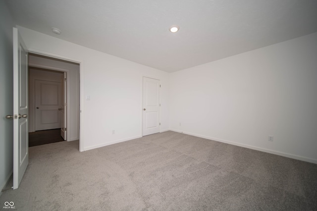 unfurnished bedroom with light carpet