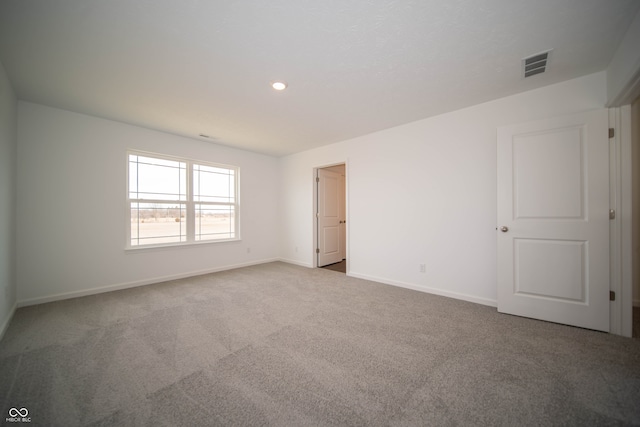 unfurnished room featuring carpet flooring