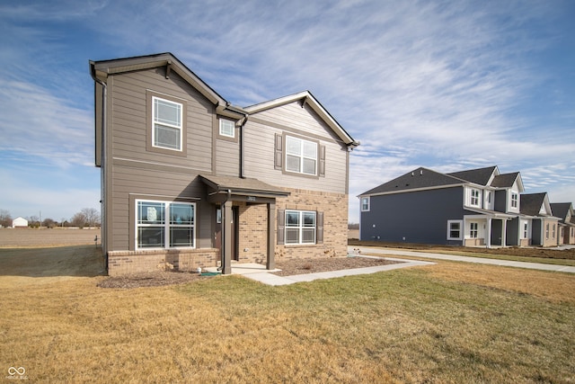 craftsman-style house with a front yard