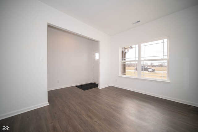 unfurnished room featuring dark hardwood / wood-style floors