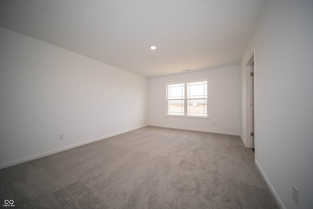 unfurnished room with carpet floors