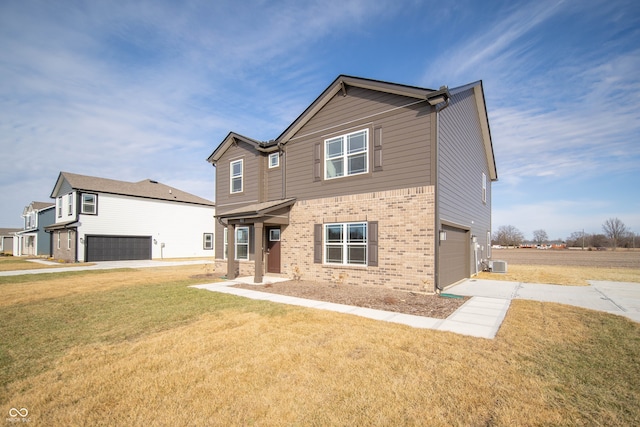 craftsman-style house with cooling unit, a garage, and a front yard