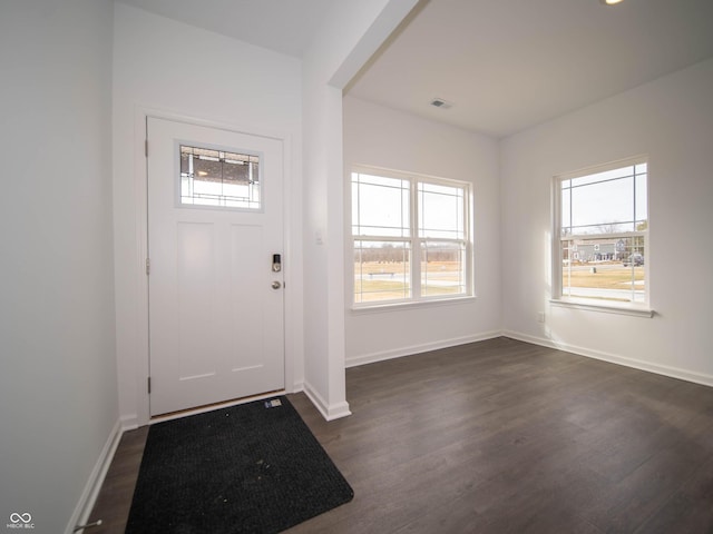 7872 Magnolia St, New Palestine, IN 46163 - entrance foyer featuring dark wood-type flooring and baseboards