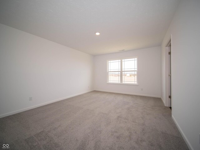 7872 Magnolia St, New Palestine, IN 46163 - empty room featuring carpet floors and recessed lighting