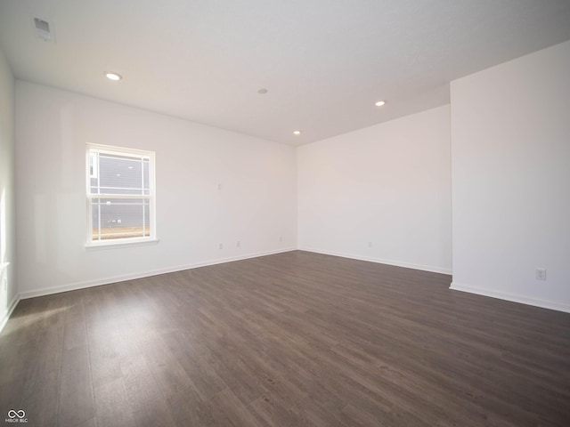 7872 Magnolia St, New Palestine, IN 46163 - empty room featuring dark wood finished floors and recessed lighting