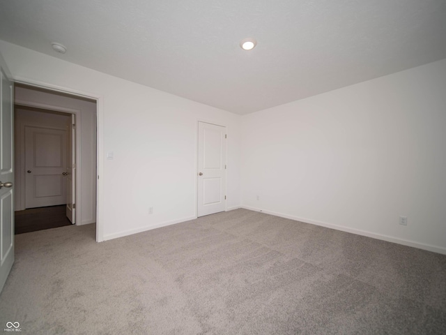 7872 Magnolia St, New Palestine, IN 46163 - carpeted empty room featuring a smoke detector and recessed lighting