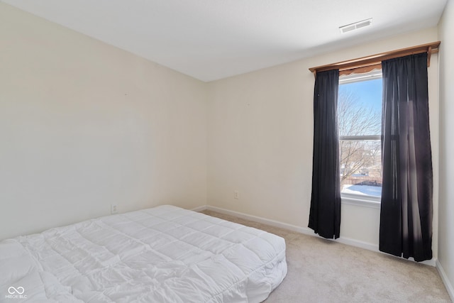 bedroom featuring light colored carpet