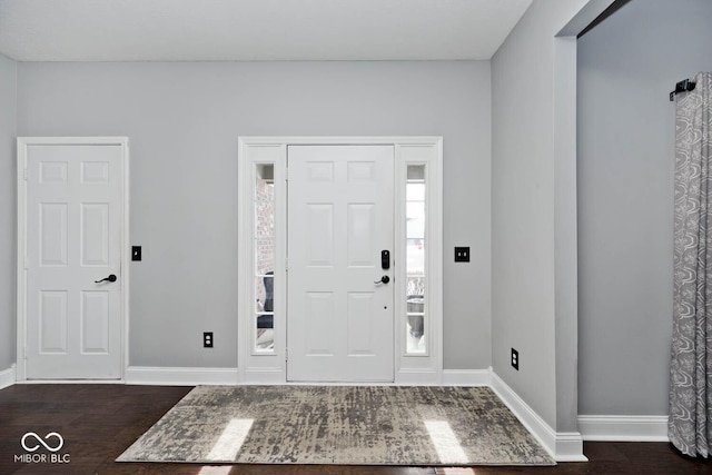 foyer with dark hardwood / wood-style floors