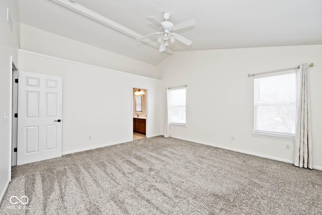 empty room with light carpet, lofted ceiling with beams, and ceiling fan