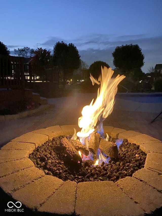 property view of water featuring an outdoor fire pit