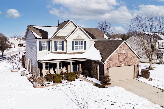 front of property with a porch and a garage