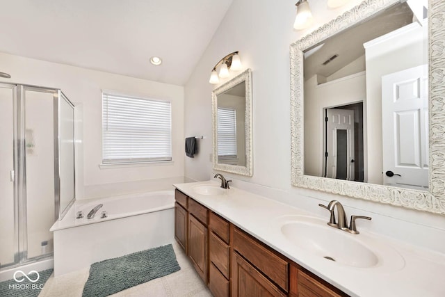 bathroom with vanity, vaulted ceiling, tile patterned floors, and shower with separate bathtub