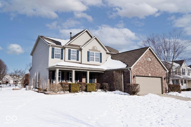 view of front of house with a garage and a porch