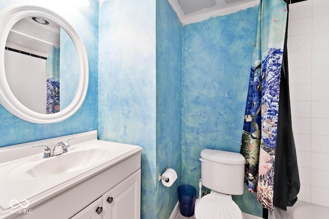 bathroom with toilet and vanity