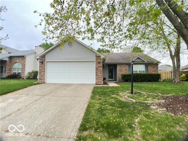 single story home with a garage and a front lawn