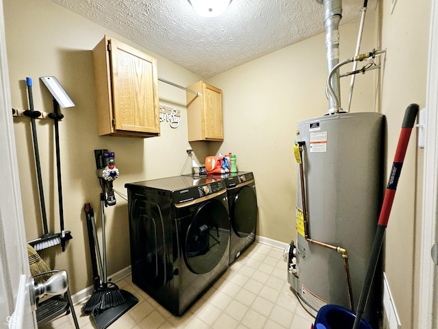 washroom featuring cabinets, independent washer and dryer, a textured ceiling, and gas water heater