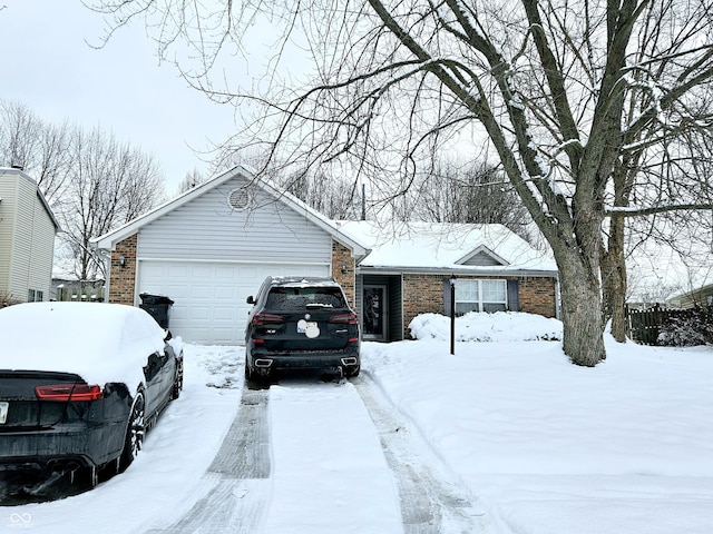 single story home featuring a garage