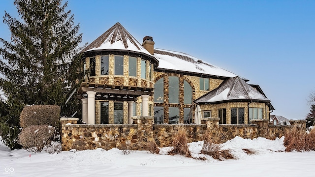 view of snow covered house