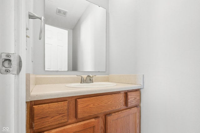 bathroom with visible vents and vanity