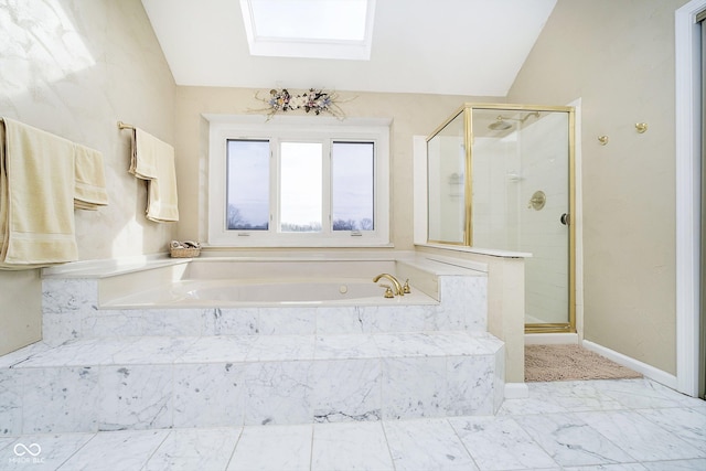 bathroom with vaulted ceiling with skylight and separate shower and tub