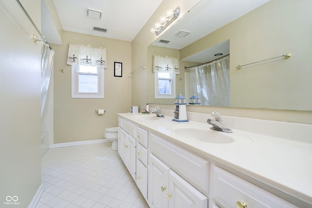 full bathroom featuring shower / bath combination with curtain, vanity, tile patterned floors, and toilet