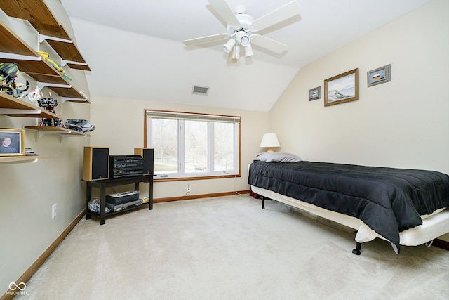 carpeted bedroom with ceiling fan and lofted ceiling