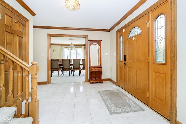 foyer featuring crown molding and light tile patterned floors