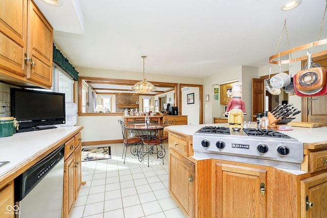 kitchen featuring pendant lighting, light tile patterned floors, and appliances with stainless steel finishes