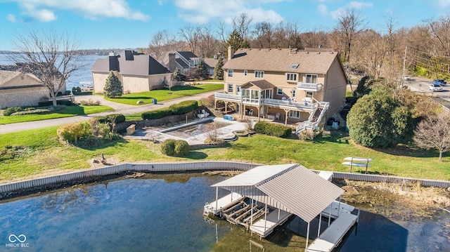 back of property featuring a water view