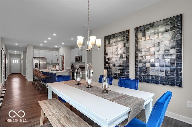 dining room featuring recessed lighting, a notable chandelier, dark wood finished floors, and baseboards