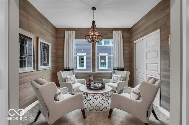 living area with an inviting chandelier and visible vents