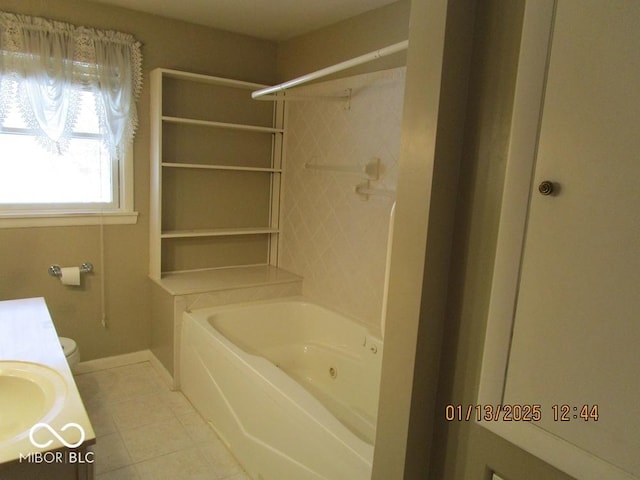 bathroom featuring toilet, tile patterned flooring, and vanity