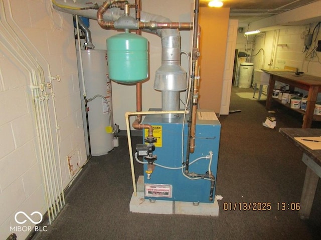 utilities featuring water heater and a heating unit