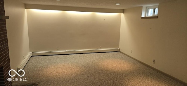 basement with recessed lighting, baseboard heating, carpet flooring, a textured ceiling, and baseboards