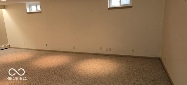 basement with baseboards and carpet flooring