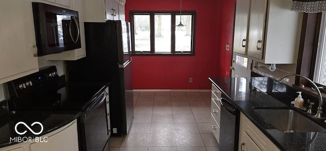 kitchen featuring light tile patterned flooring, a sink, white cabinetry, baseboards, and black appliances