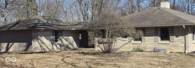 view of home's exterior with roof with shingles