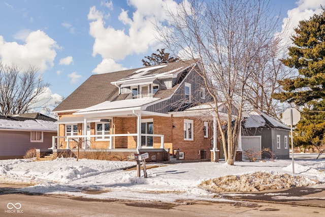 view of front property with a porch and a garage