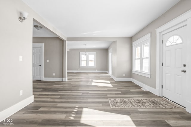 entryway with dark wood-type flooring