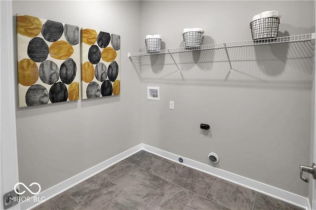 laundry area featuring hookup for a gas dryer, hookup for an electric dryer, laundry area, washer hookup, and baseboards