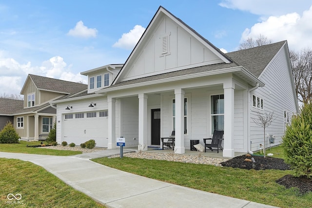 view of front of home featuring a garage, roof with shingles, a porch, board and batten siding, and a front yard