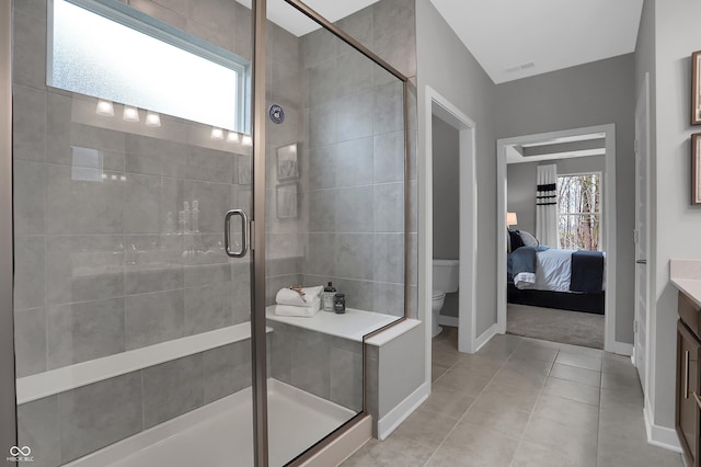 ensuite bathroom with a healthy amount of sunlight and a shower stall