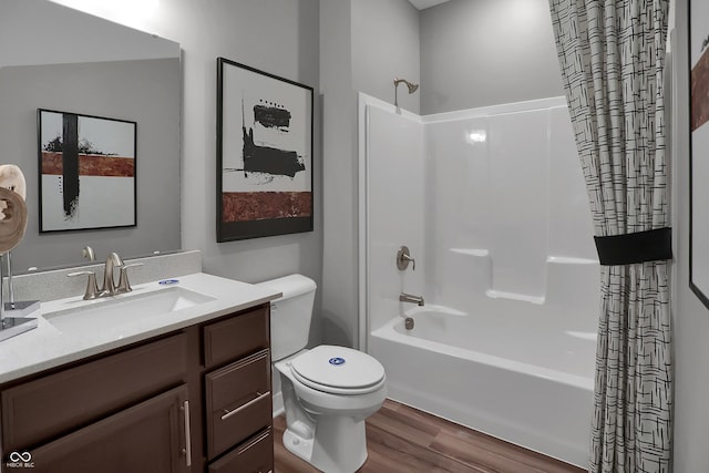 bathroom with vanity, shower / tub combo, wood finished floors, and toilet