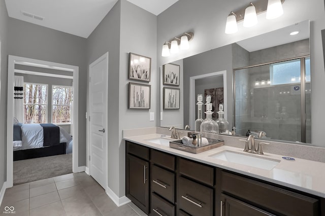 full bath with a wealth of natural light, visible vents, and a sink