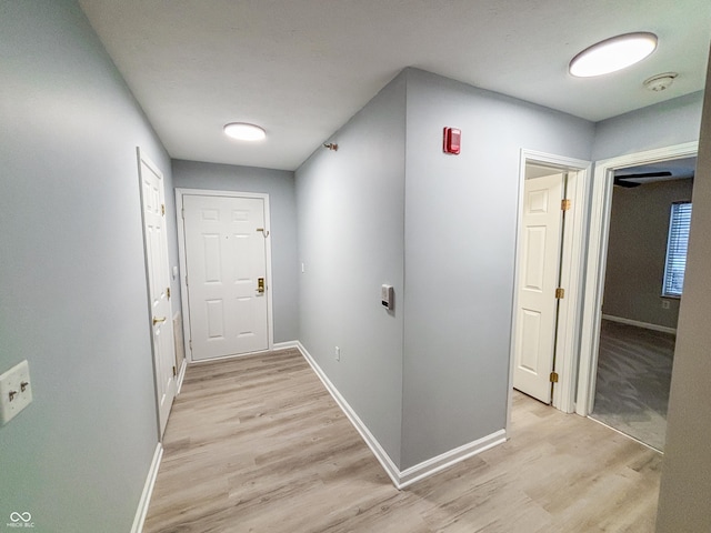 corridor featuring light hardwood / wood-style flooring