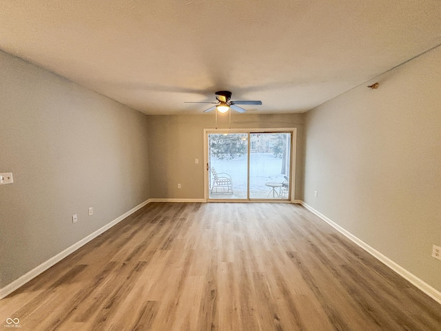 unfurnished room featuring ceiling fan and light hardwood / wood-style flooring