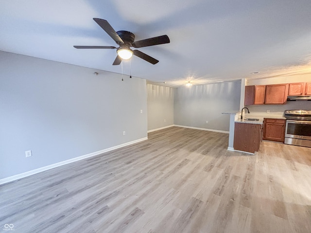 interior space featuring sink, ceiling fan, and light hardwood / wood-style floors