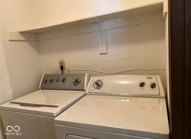 washroom featuring independent washer and dryer